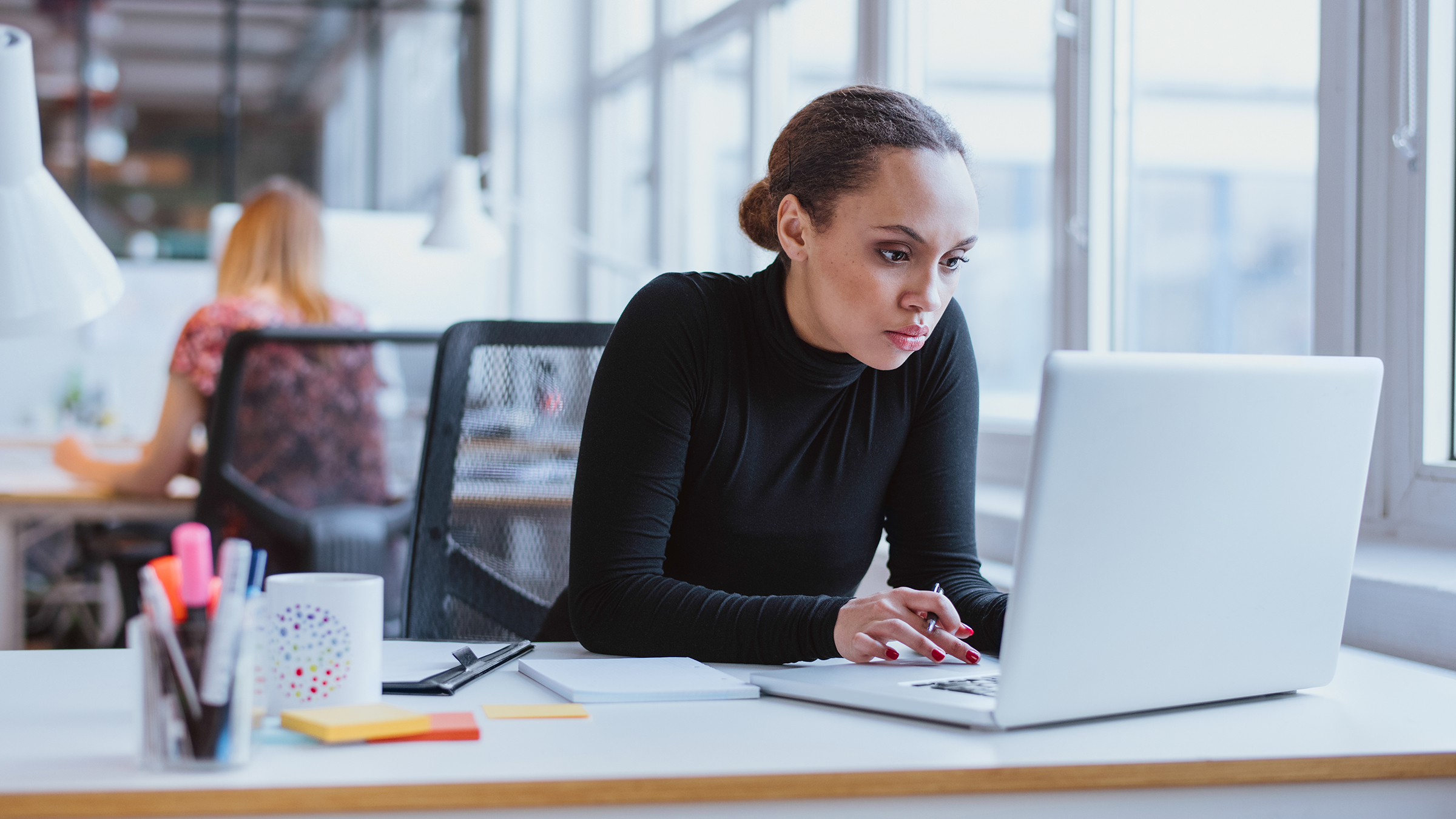 Thumbnail Young african american business woman working on laptop